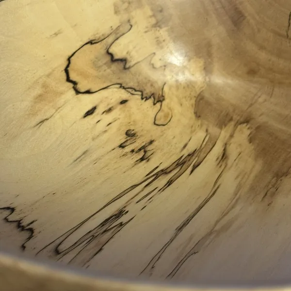 Hand-turned spalted maple bowl showing dramatic dark spalting lines