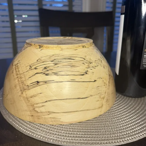 Hand-turned spalted maple bowl showing dramatic dark spalting lines