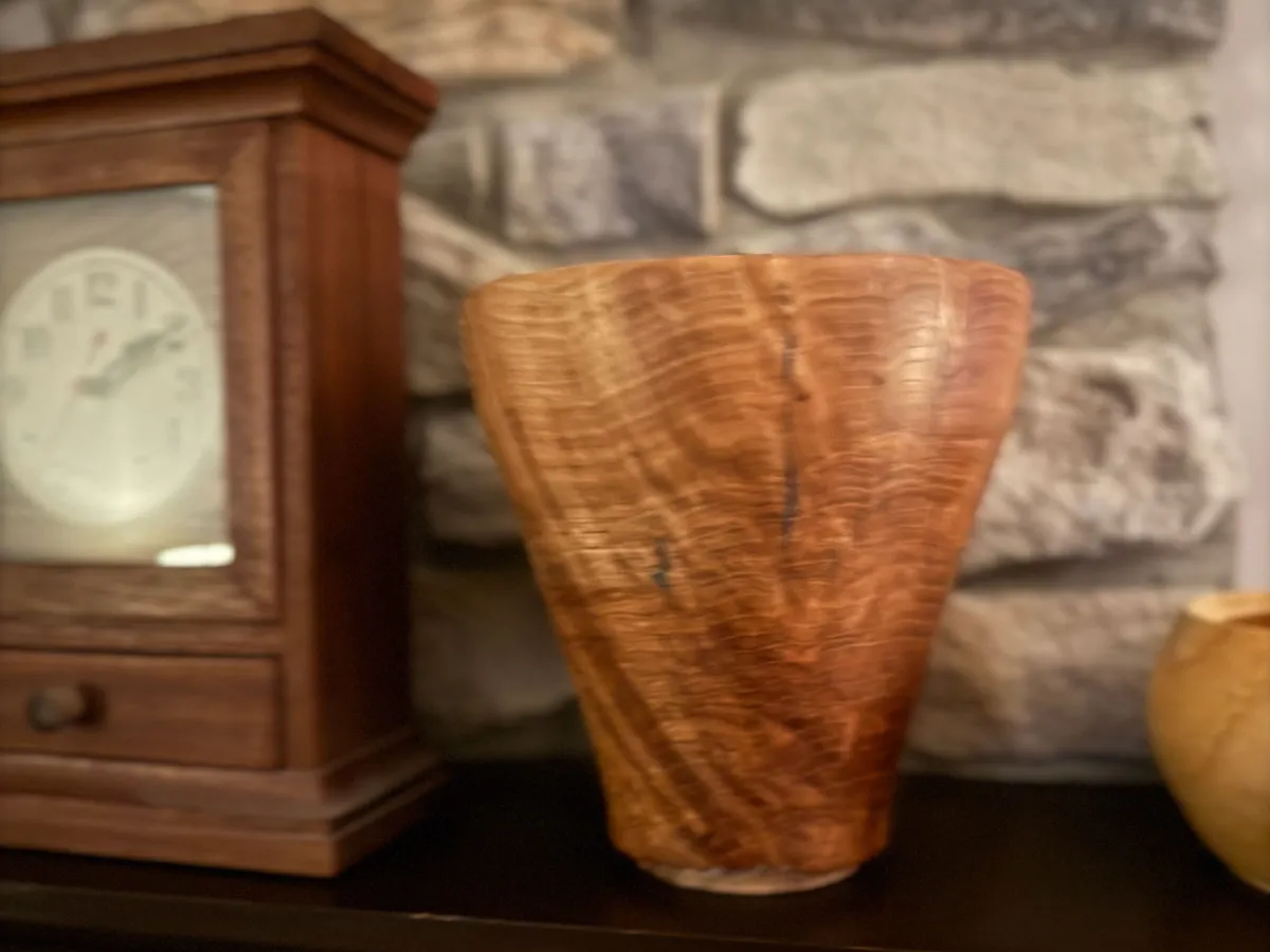 Hand-turned white oak burl vase showing warm burl figure and blue resin detail