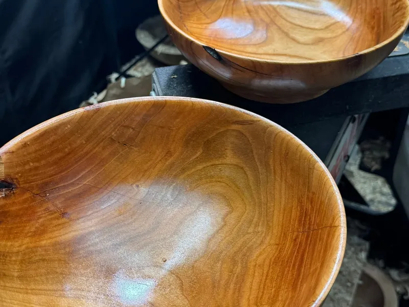 Two hand-turned cherry bowls — consecutive blanks from the same log, each slightly different