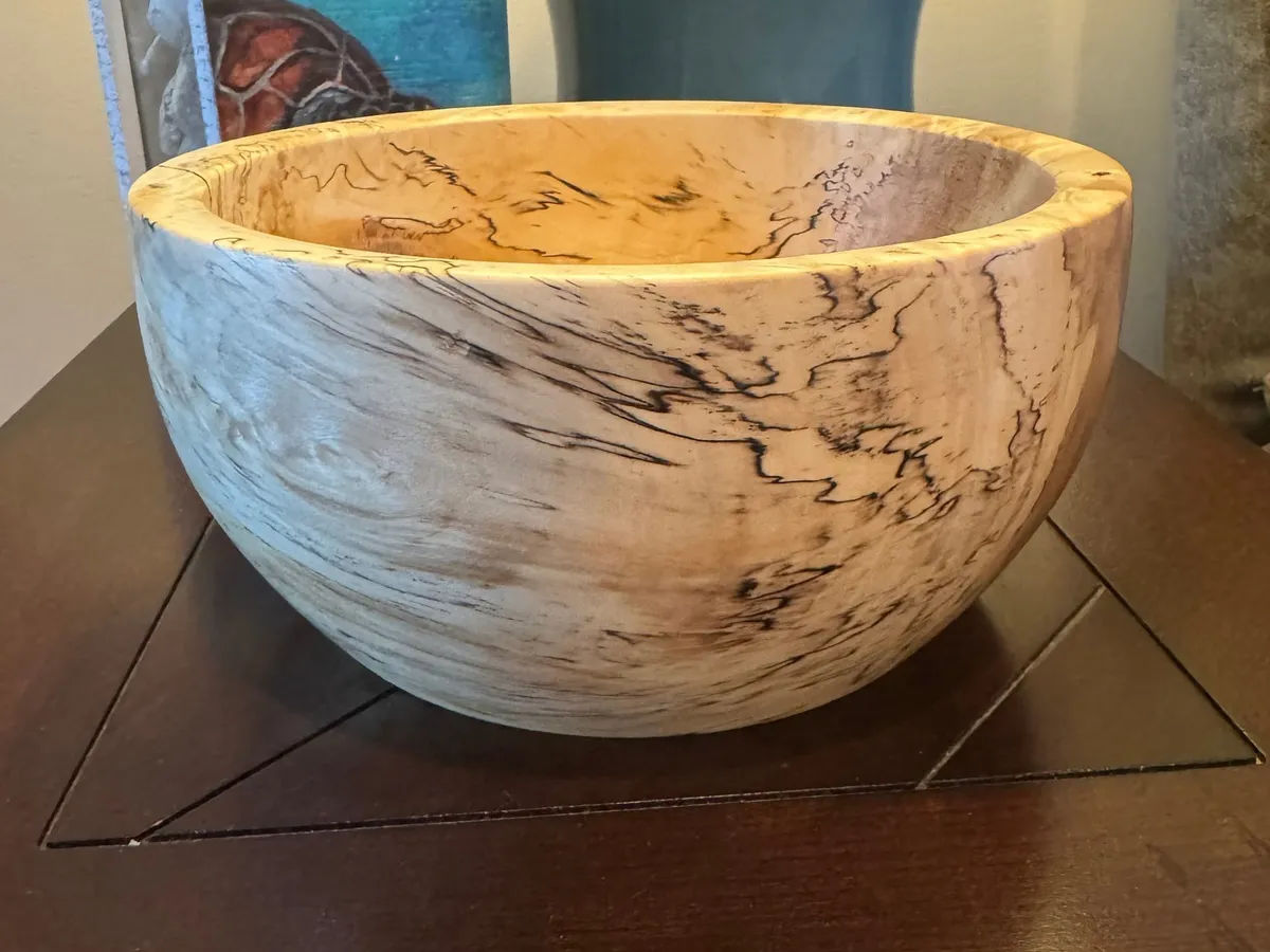 Spalted maple bowl detail showing dark zone lines through pale wood