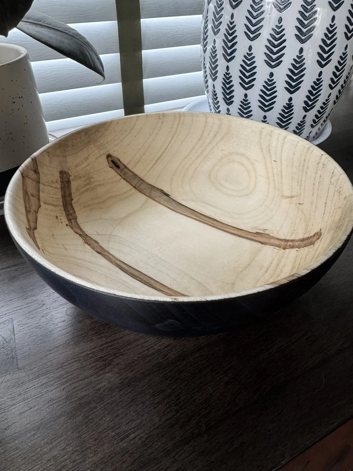 Top view of ambrosia maple bowl showing natural beetle figure and bark inclusions through color treatment
