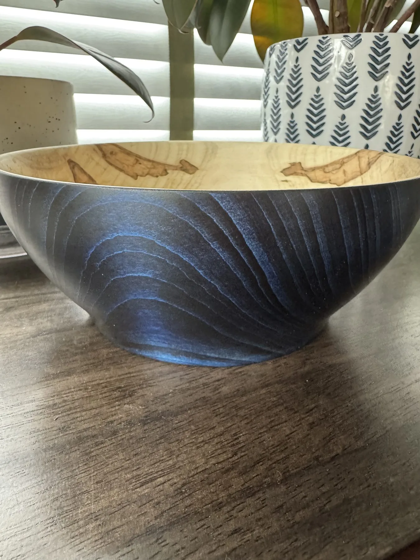 Color-enhanced ambrosia maple bowl with blue-black exterior and pale natural interior