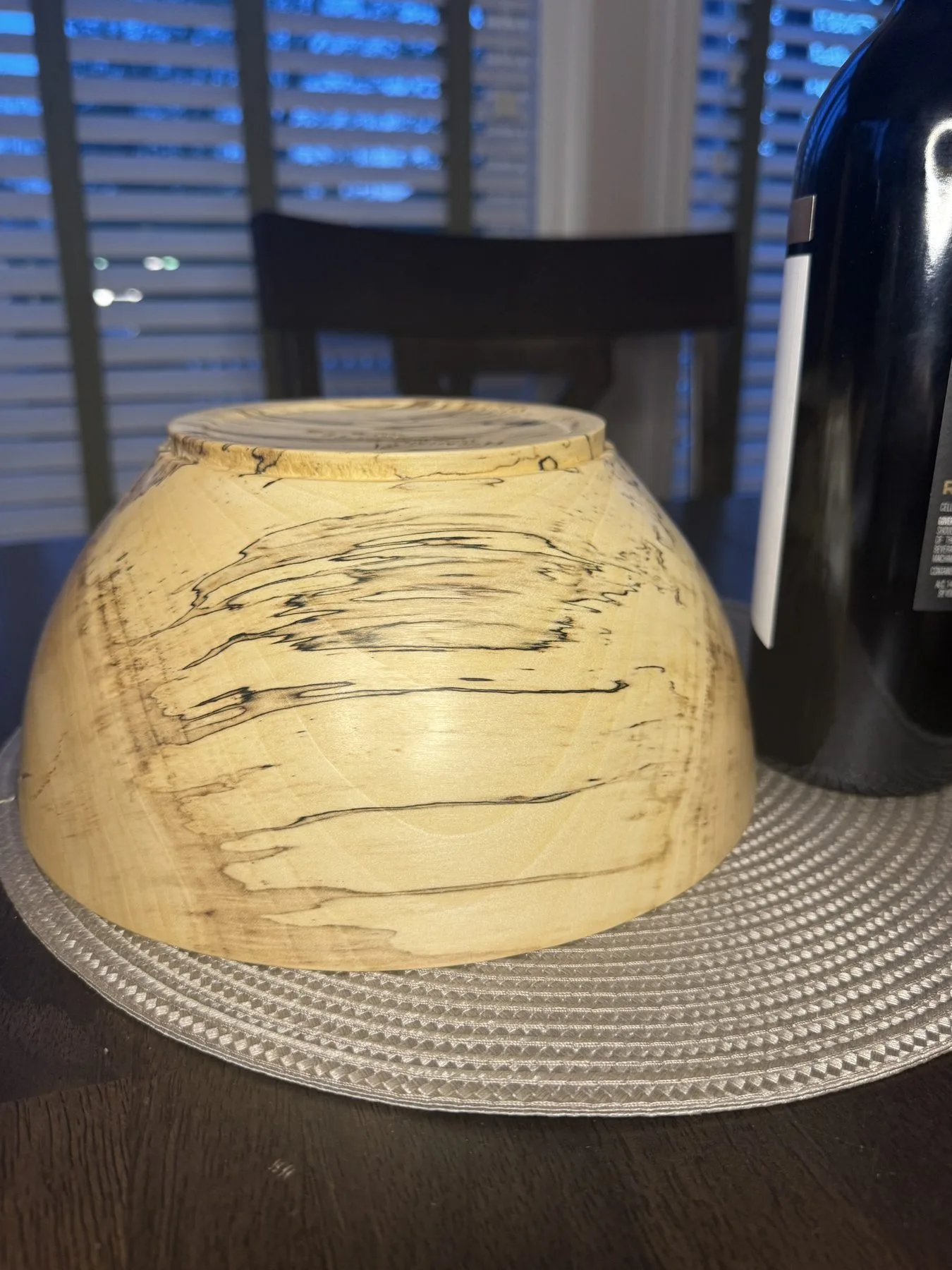 Close-up detail of spalted maple bowl showing dramatic black zone lines and fungal figure in pale wood