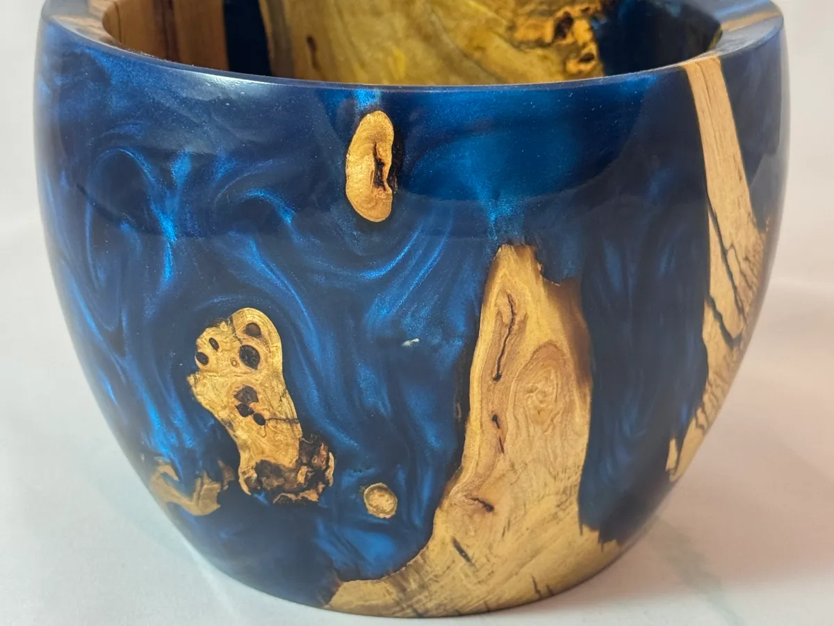 Finished apple wood and electric blue resin bowl kept in Kevin's personal collection
