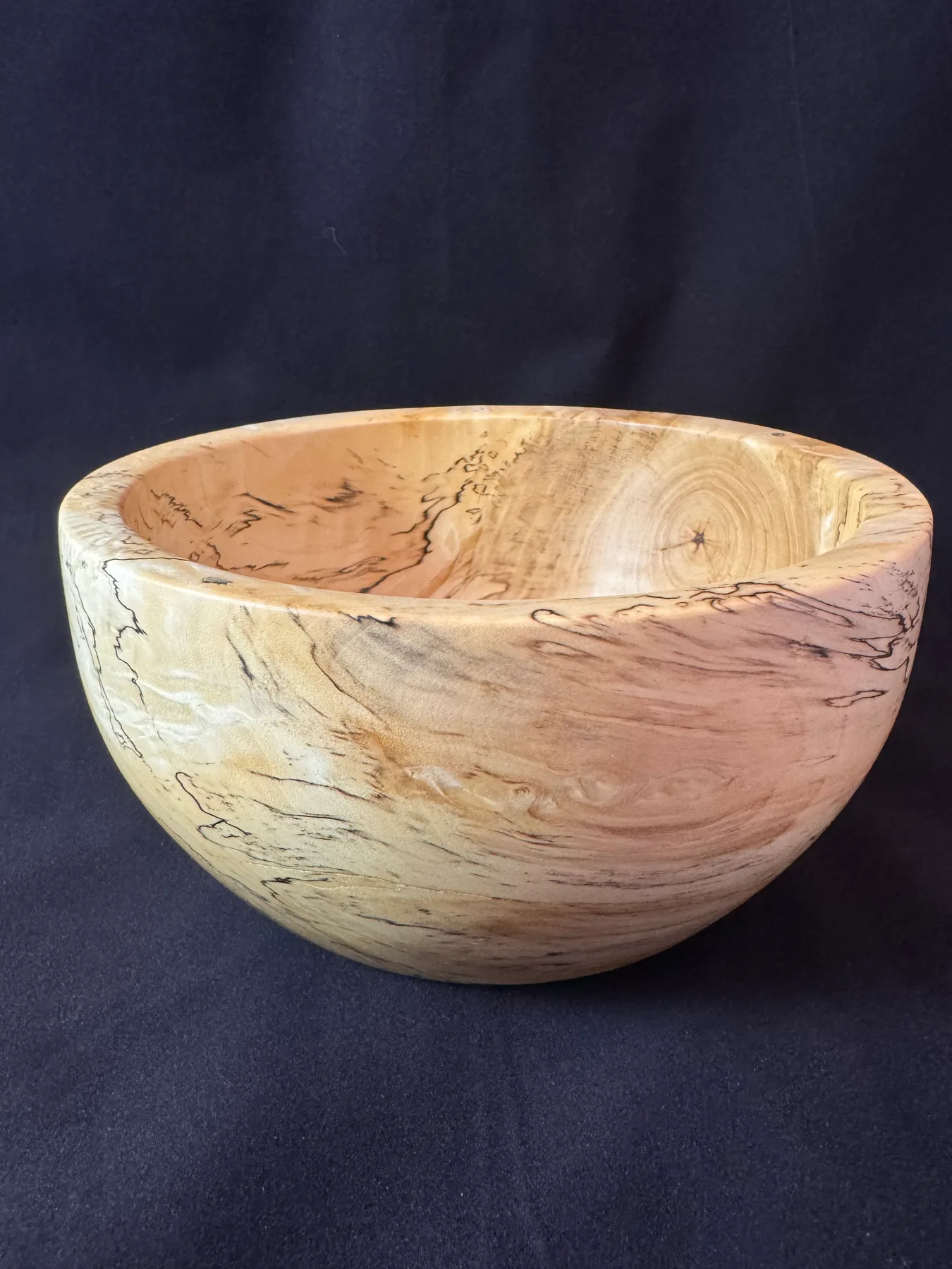 Interior view of small spalted maple bowl with natural zone-line pattern
