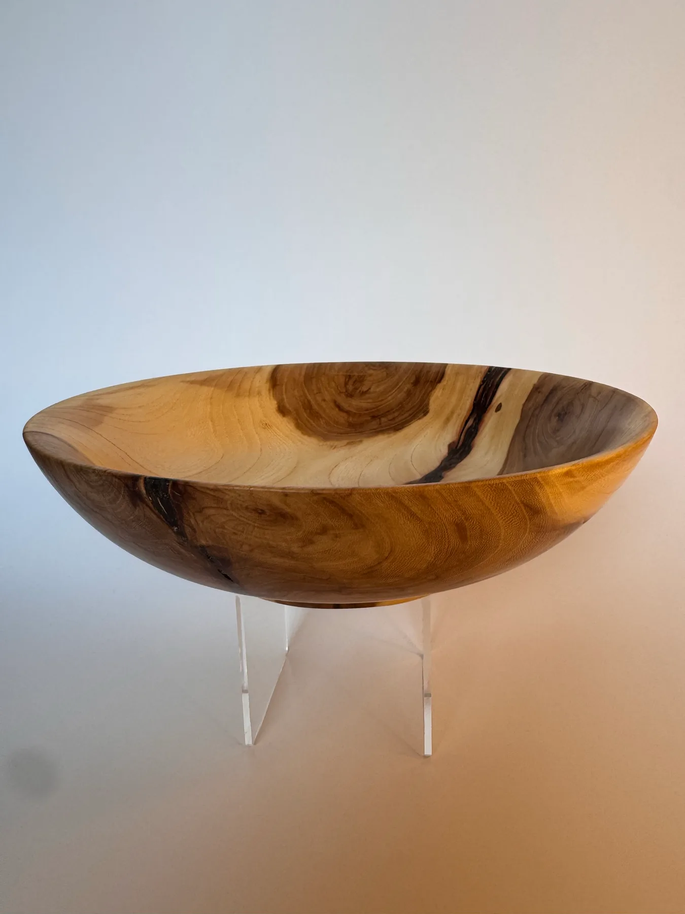 Side view of low apple wood bowl showing natural bark inclusion