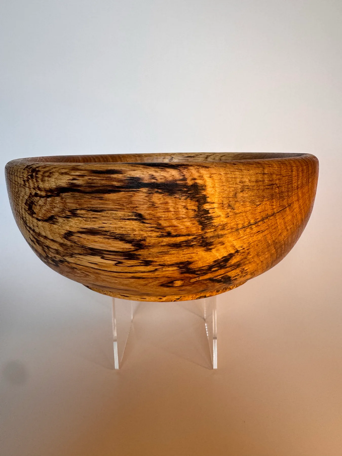 Side view of a hand-turned spalted oak bowl