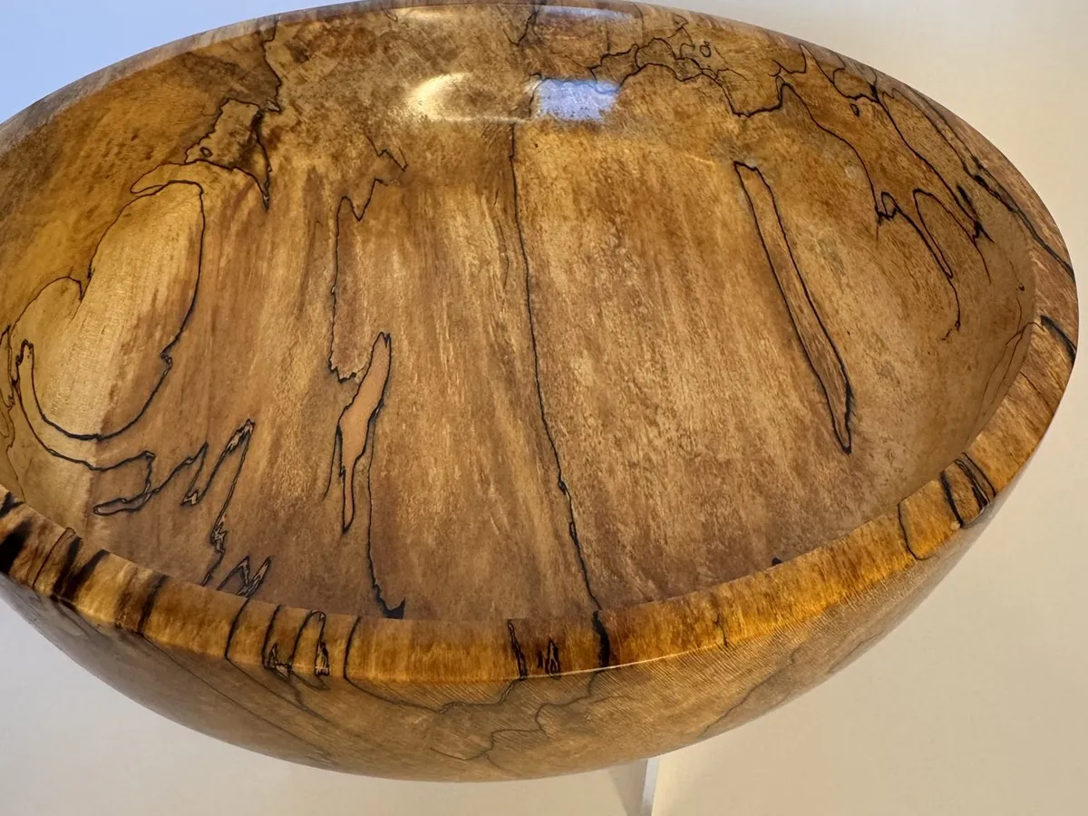 Interior view of spalted maple bowl showing softer pale wood and dark streaking