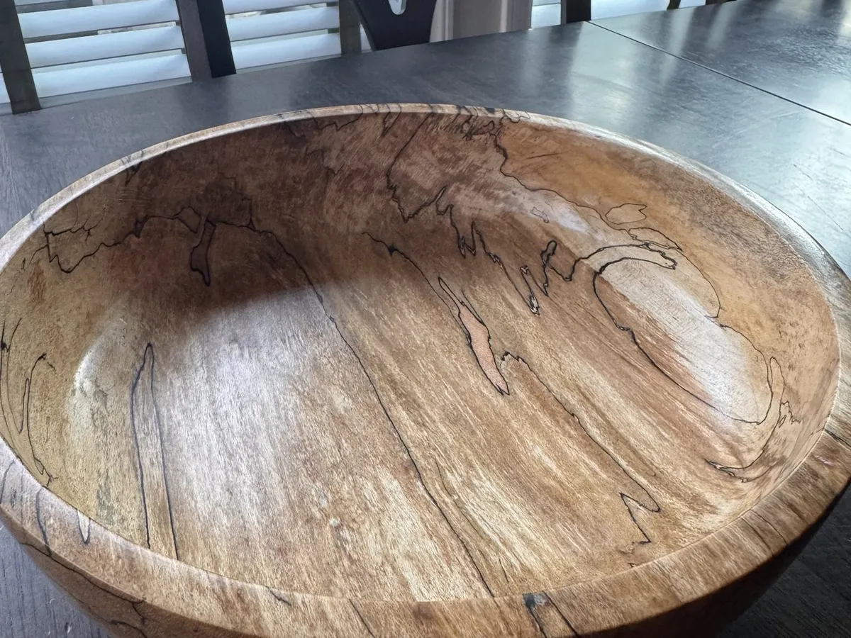 Close interior view of spalted maple bowl with glossy shellac and wax finish