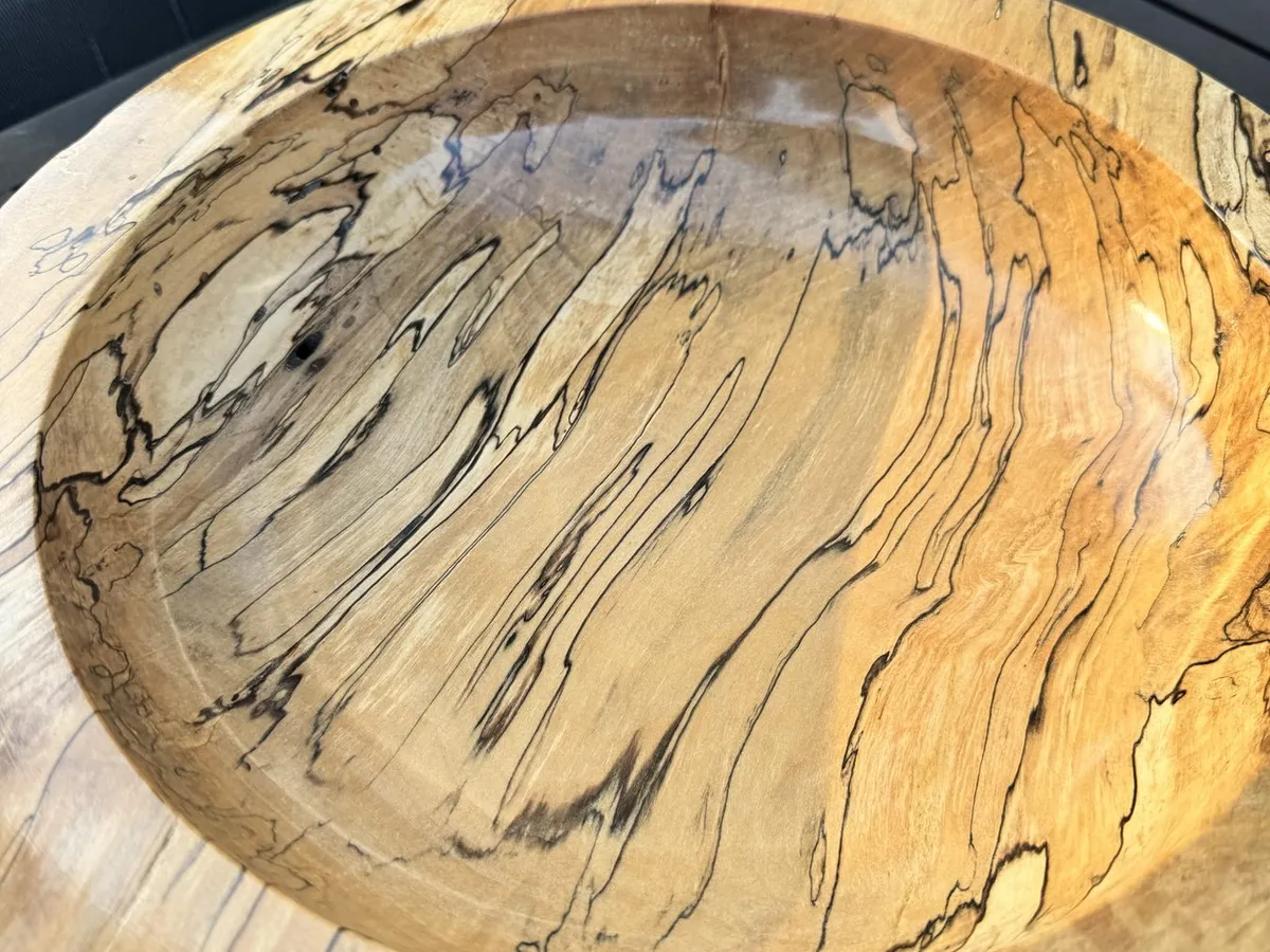 Overhead perspective of 14-inch spalted maple bowl showing flame grain and dark figure