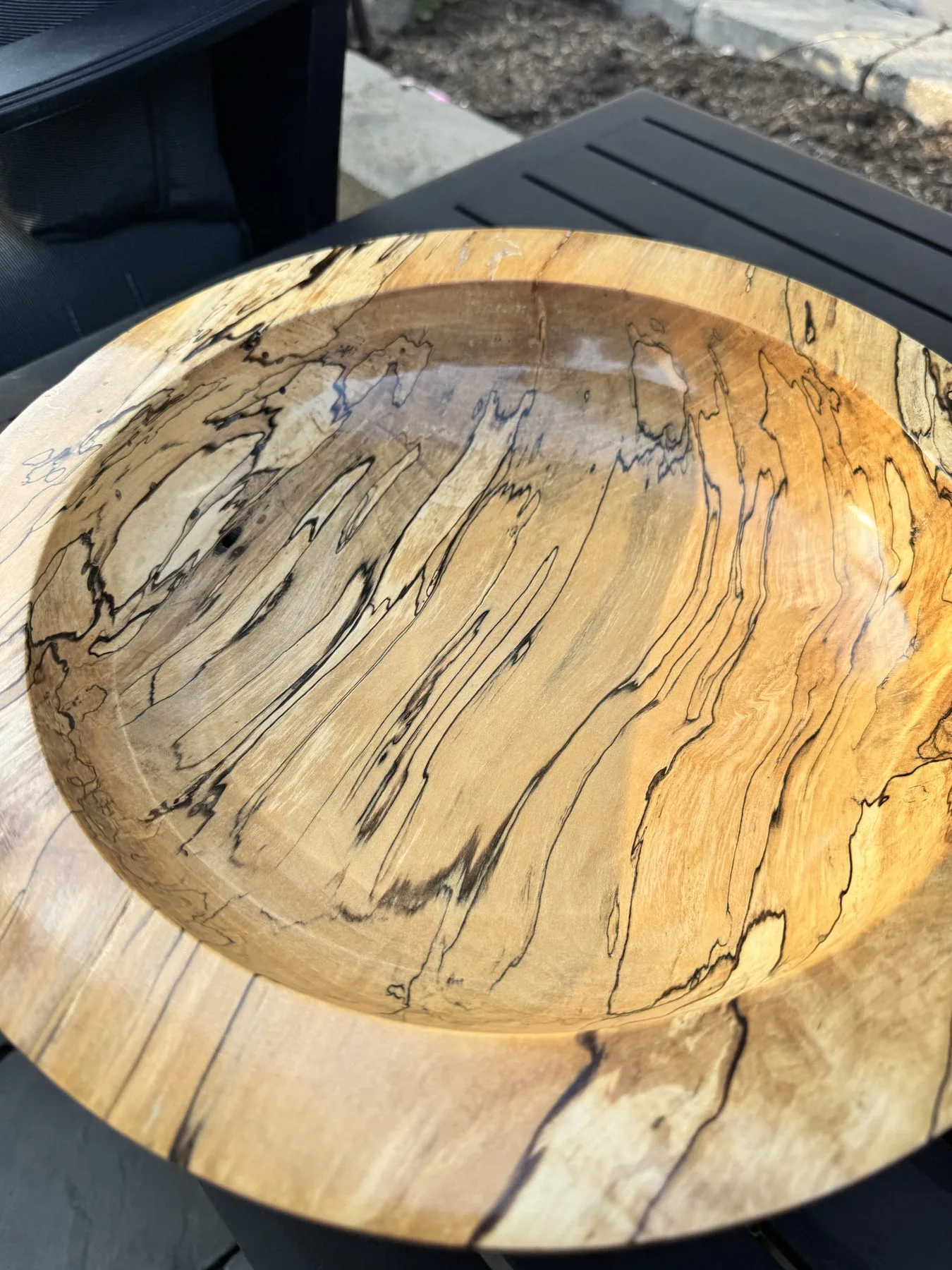 Overhead perspective of 14-inch spalted maple bowl showing flame grain and dark figure