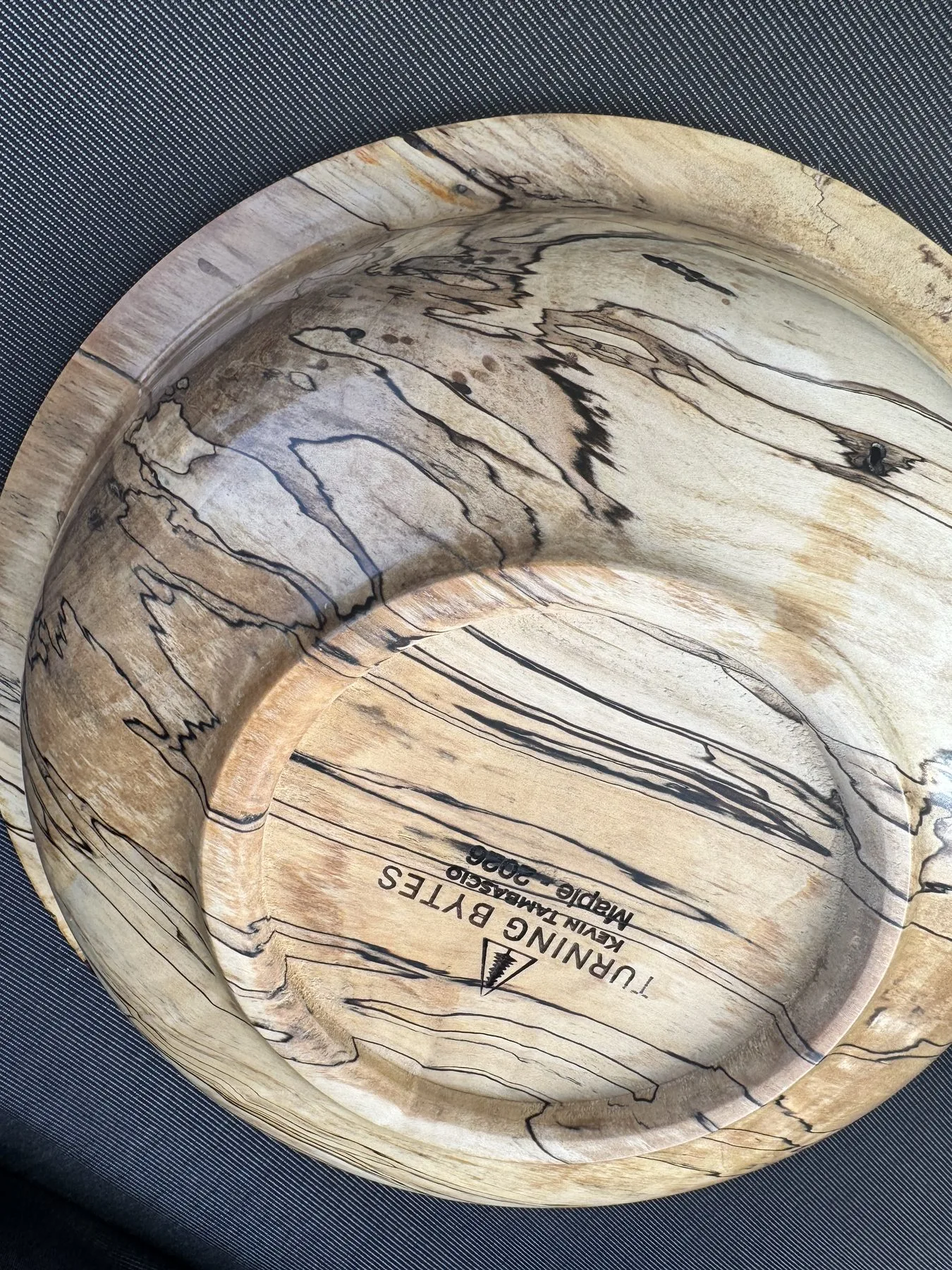 Underside view showing Turning Bytes Kevin Tambascio maker stamp on foot