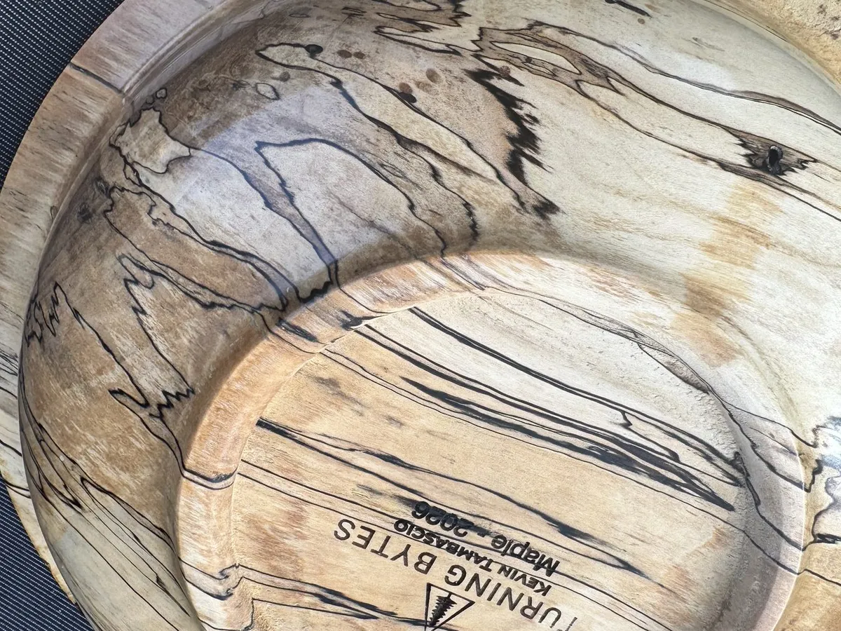 Underside view showing Turning Bytes Kevin Tambascio maker stamp on foot