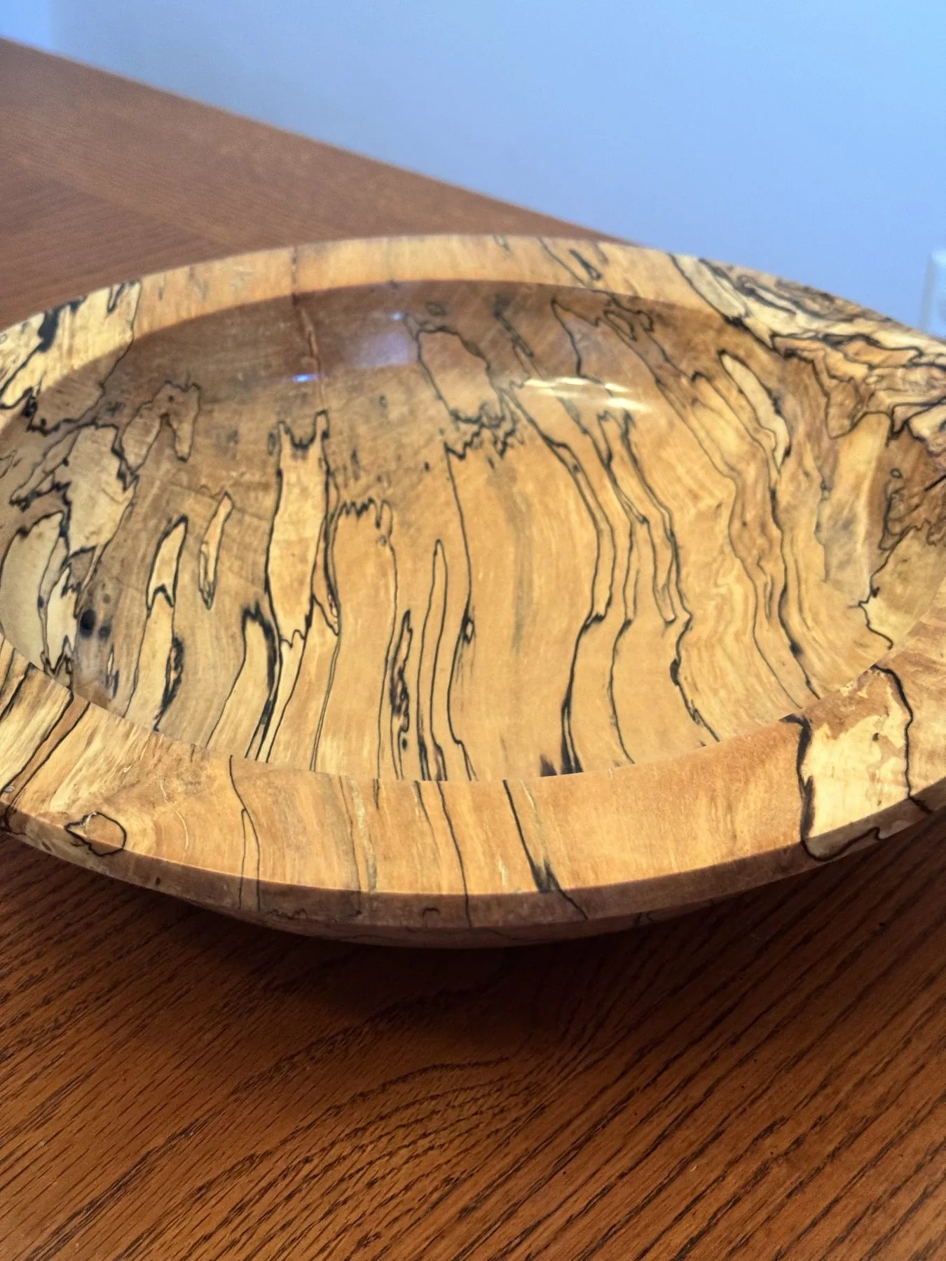 Detailed view looking into the interior basin displaying intense black spalted lines