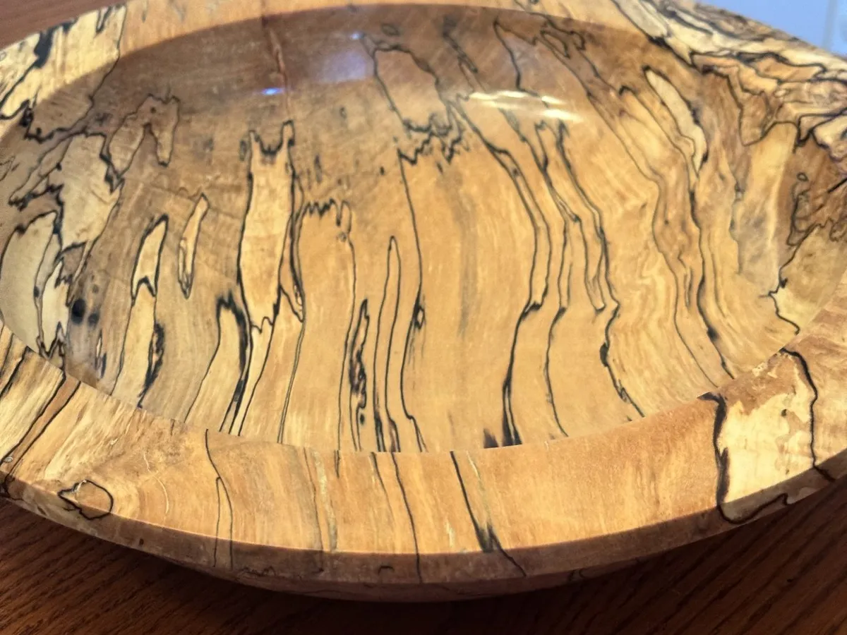 Detailed view looking into the interior basin displaying intense black spalted lines