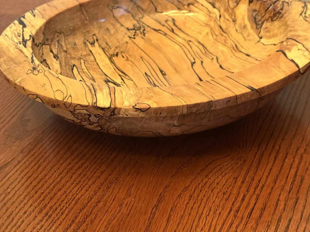 Low angle view highlighting wide gallery rim contour and 14-inch scale