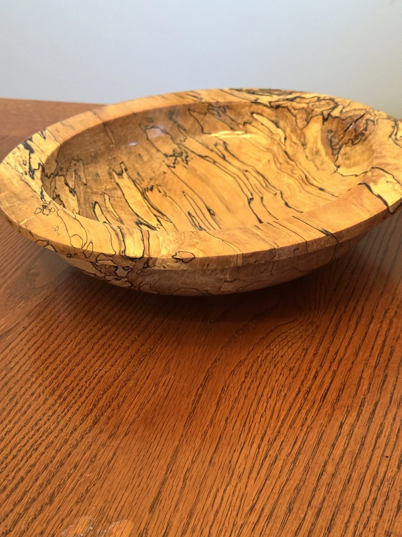 Low angle view highlighting wide gallery rim contour and 14-inch scale